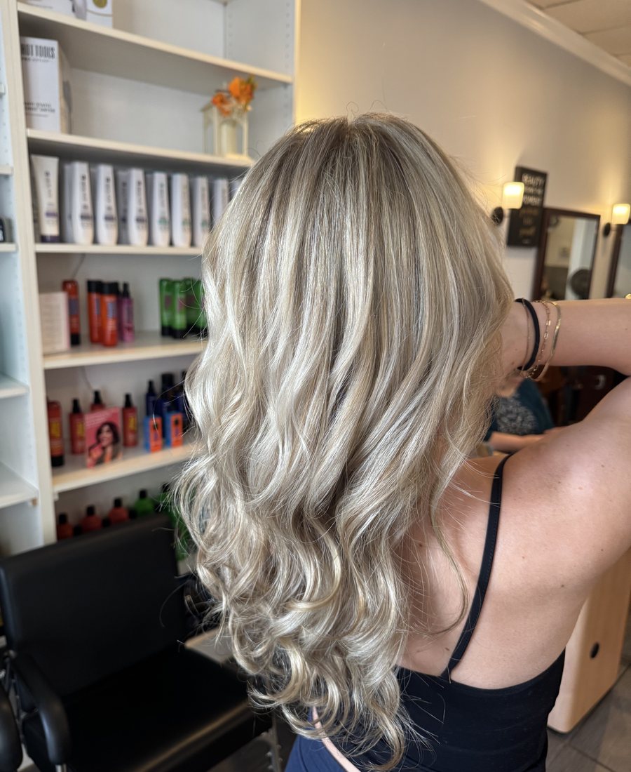 Blonde curls styled at Hair Xpressions in Fairfax, Virginia